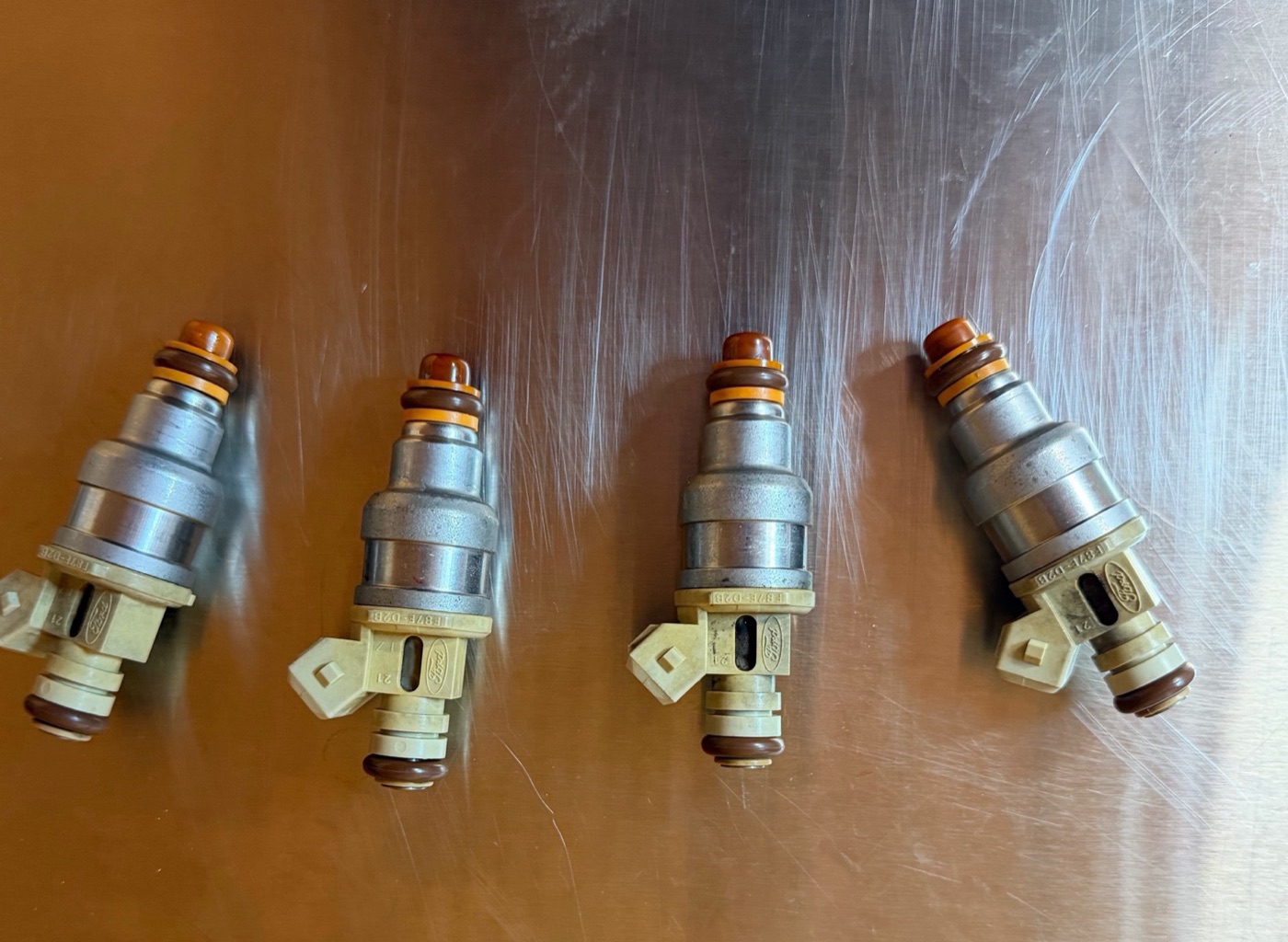 The same marine injector set, cleaned and flow-tested on the bench