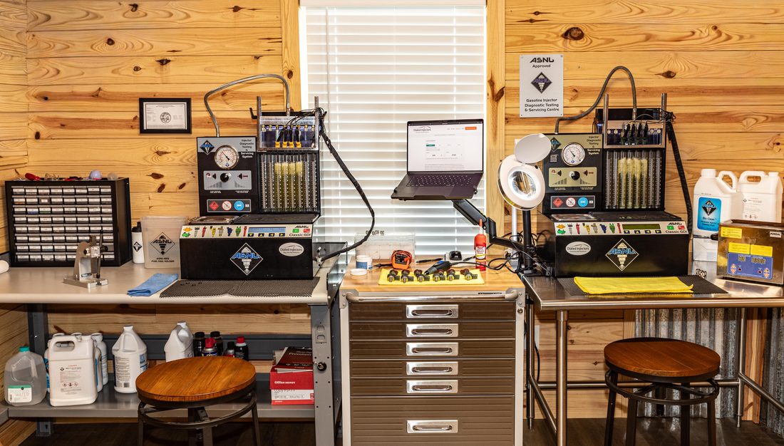 Two ASNU 5000 diagnostic workstations used for fuel injector flow testing and cleaning